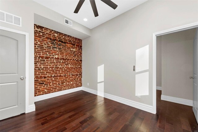 3330 Iowa Ave, Saint Louis, MO 63118 - empty room with wood-type flooring, ceiling fan, brick wall, baseboards, and recessed lighting