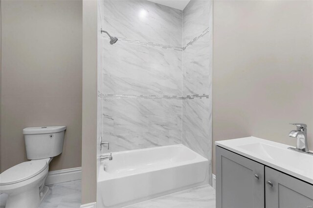 3330 Iowa Ave, Saint Louis, MO 63118 - bathroom featuring marble look tile flooring, toilet, baseboards, and vanity