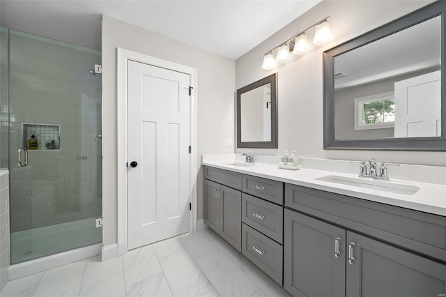 bathroom featuring a stall shower, double vanity, baseboards, and marble look tile flooring