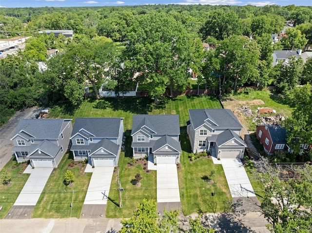 aerial perspective of suburban area with a heavily wooded area