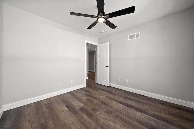 unfurnished bedroom with dark wood-style floors, baseboards, and a ceiling fan