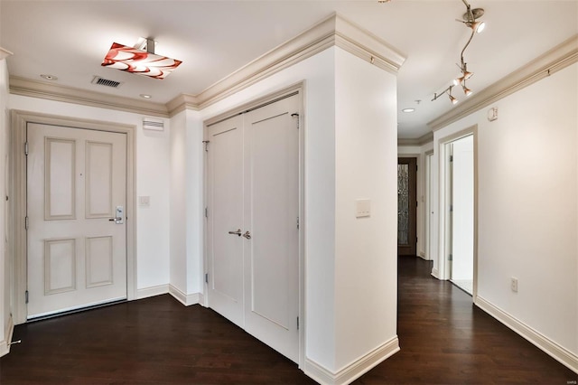4909 Laclede Ave Unit 1401, Saint Louis, MO 63108 - hallway featuring ornamental molding, dark wood finished floors, baseboards, and track lighting