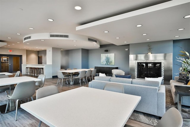 4909 Laclede Ave Unit 1401, Saint Louis, MO 63108 - living room featuring recessed lighting, wood finished floors, and a tile fireplace