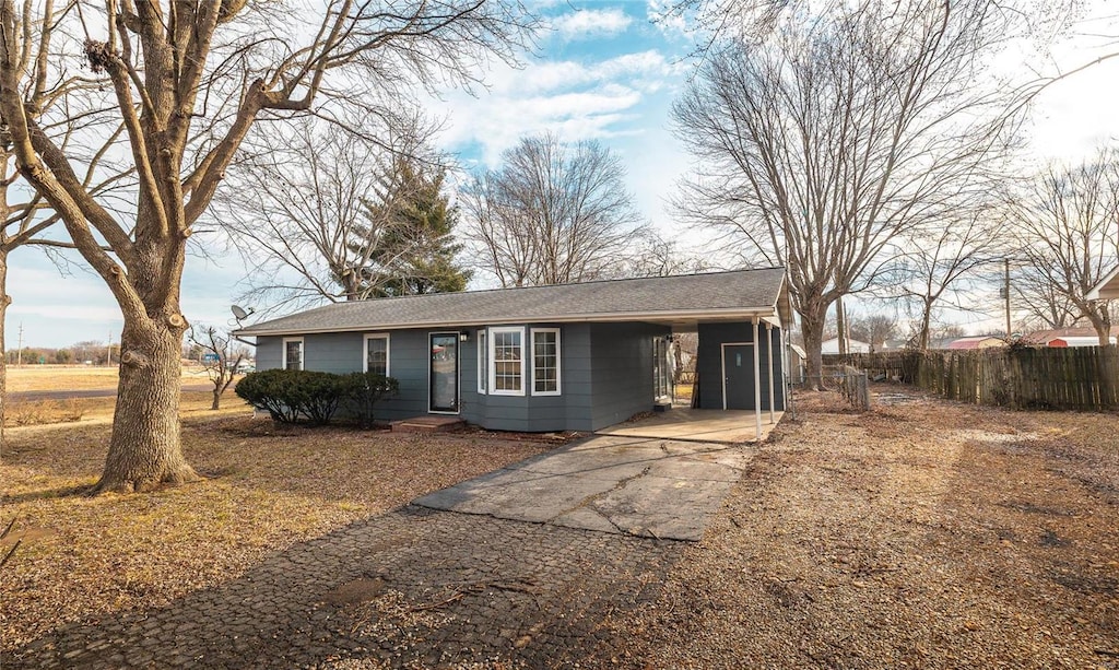 1 Marion Dr, St James, MO 65559 - ranch-style home with asphalt driveway, fence, and an attached carport