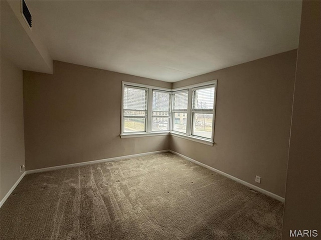 907 S Hanley Rd Unit 5, Clayton, MO 63105 - carpeted spare room with baseboards