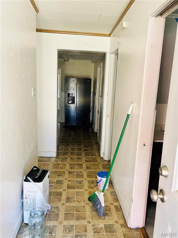 10719 Thorpe Ave, Saint Louis, MO 63114 - hall featuring crown molding and baseboards