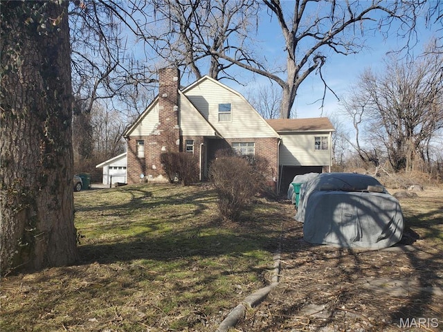 45 Jarvis Pl, Cahokia, IL 62207 - view of side of home featuring brick siding, a chimney, and a yard
