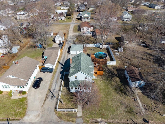 aerial view of property and surrounding area with nearby suburban area