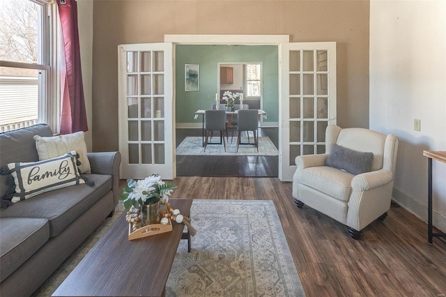 living room featuring wood finished floors and baseboards