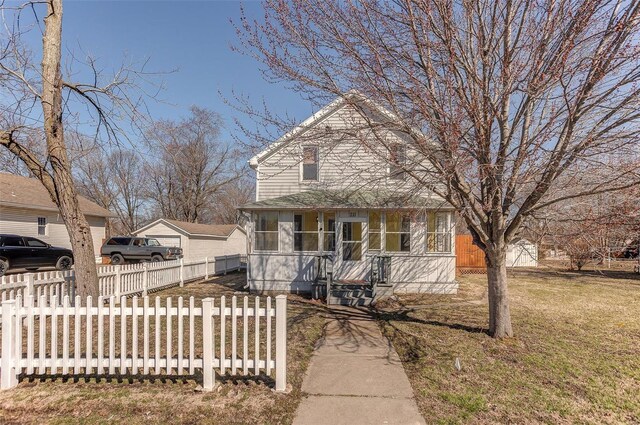 view of front of home featuring a sunroom