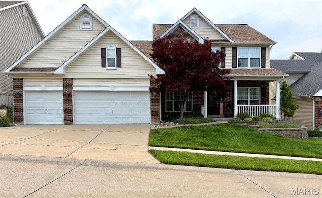 885 Morgan Rdg, High Ridge, MO 63049 - traditional-style home with concrete driveway, a front yard, covered porch, brick siding, and a garage