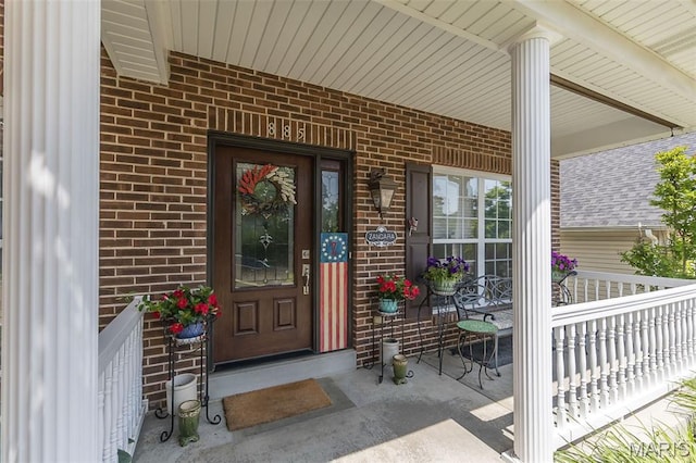 885 Morgan Rdg, High Ridge, MO 63049 - property entrance featuring covered porch and brick siding
