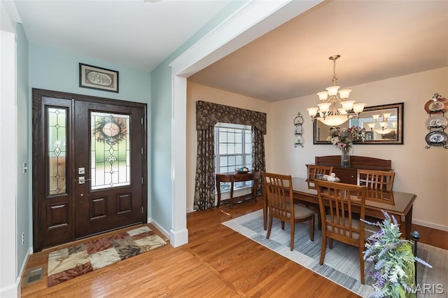 885 Morgan Rdg, High Ridge, MO 63049 - dining area featuring a chandelier and light wood finished floors