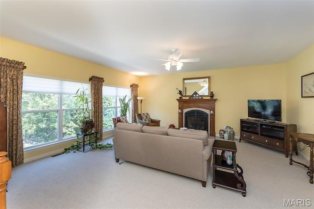 885 Morgan Rdg, High Ridge, MO 63049 - living room with carpet floors, a fireplace, and a ceiling fan