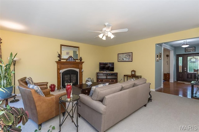 885 Morgan Rdg, High Ridge, MO 63049 - carpeted living area featuring a fireplace and a ceiling fan