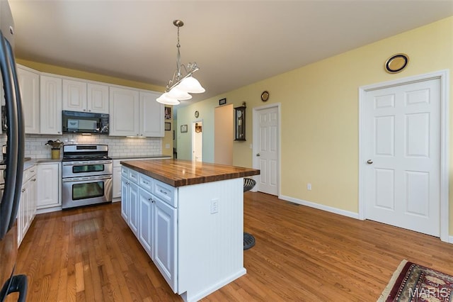 885 Morgan Rdg, High Ridge, MO 63049 - kitchen featuring stainless steel appliances, wood counters, white cabinetry, tasteful backsplash, and a kitchen island