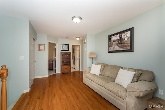 885 Morgan Rdg, High Ridge, MO 63049 - living area featuring wood finished floors and baseboards