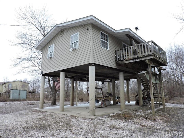 17 Martone St, Elsberry, MO 63343 - back of property with a storage unit, a patio, an outbuilding, cooling unit, and stairs