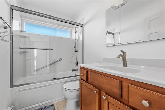full bathroom with toilet, combined bath / shower with glass door, vanity, tile patterned floors, and ornamental molding