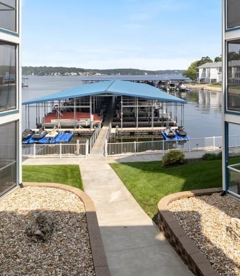 18051 Blue Anchor Dr Unit 522, Gravois Mills, MO 65037 - dock area featuring boat lift, a water view, and a lawn