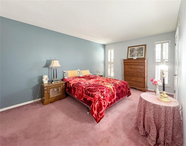 3253 Leisurewood Ct Unit G, Florissant, MO 63033 - carpeted bedroom featuring multiple windows, baseboards, and a textured ceiling