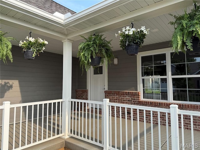 40 Butterfield, Farmington, MO 63640 - property entrance with a porch, brick siding, and a shingled roof