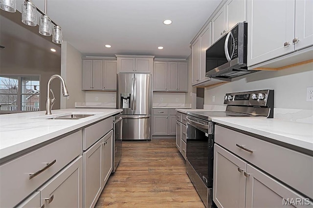 40 Butterfield, Farmington, MO 63640 - kitchen featuring stainless steel appliances, gray cabinetry, a sink, wood finished floors, and recessed lighting