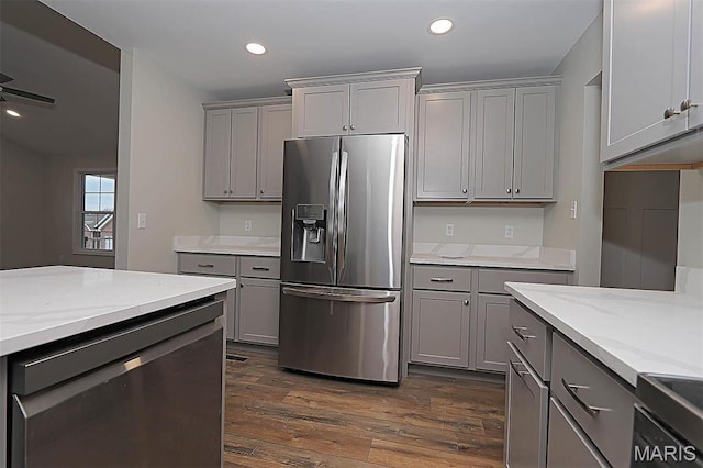 40 Butterfield, Farmington, MO 63640 - kitchen featuring appliances with stainless steel finishes, gray cabinetry, dark wood-style flooring, light stone countertops, and recessed lighting