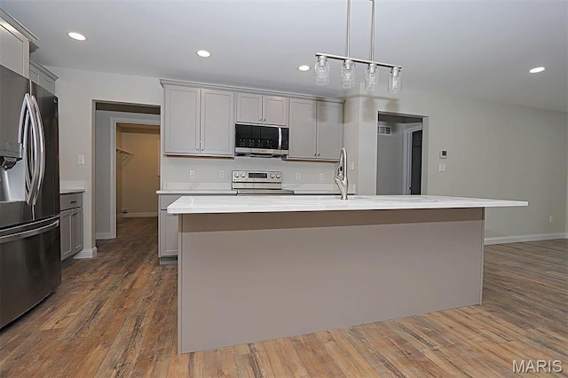 40 Butterfield, Farmington, MO 63640 - kitchen featuring appliances with stainless steel finishes, gray cabinets, light countertops, a sink, and dark wood finished floors