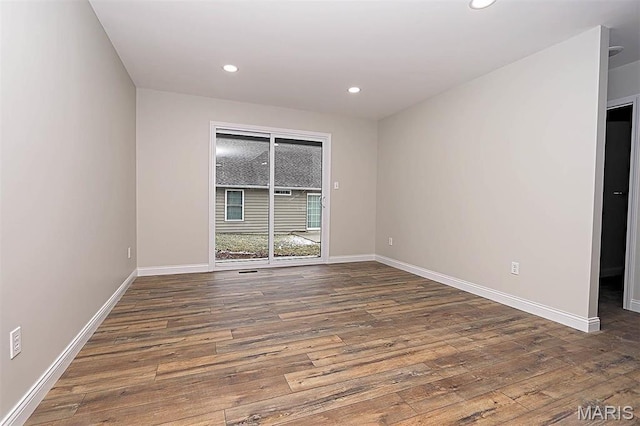 40 Butterfield, Farmington, MO 63640 - spare room with wood finished floors, baseboards, and recessed lighting