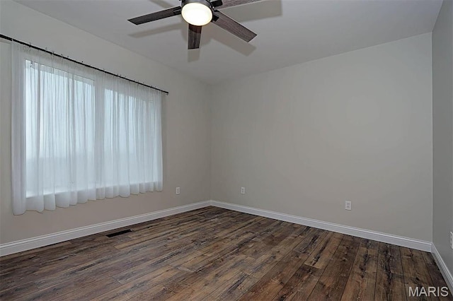 40 Butterfield, Farmington, MO 63640 - empty room with dark wood-style flooring, a ceiling fan, and baseboards
