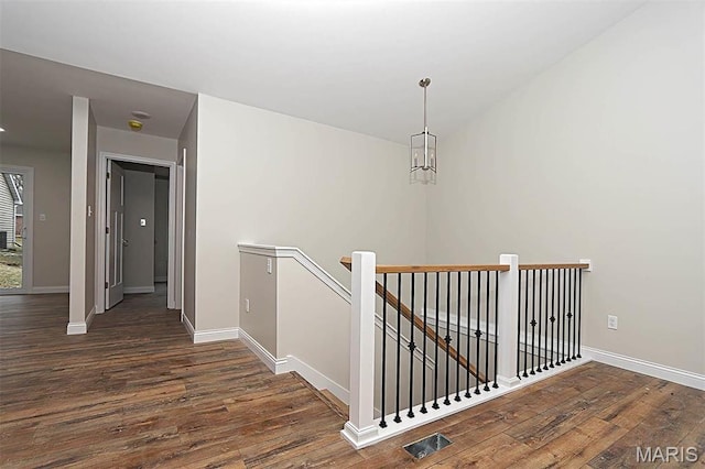 40 Butterfield, Farmington, MO 63640 - hall featuring an upstairs landing, wood finished floors, and baseboards