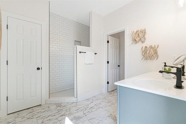 2306 Clare Ct Unit 75Stb, Washington, MO 63090 - bathroom featuring marble finish flooring, walk in shower, a sink, and baseboards