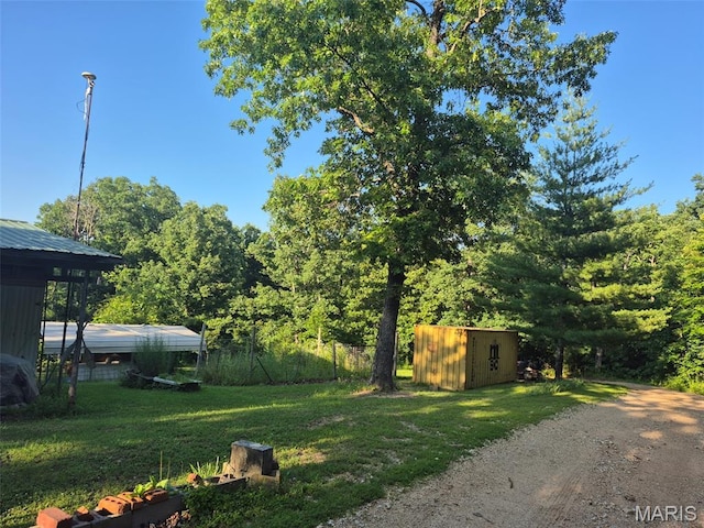 169 Clover Ln, Bourbon, MO 65441 - view of grassy yard featuring a shed