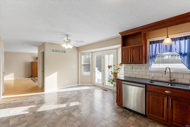 2537 Castle Pines Dr, Imperial, MO 63052 - kitchen featuring stainless steel dishwasher, a sink, plenty of natural light, ceiling fan, and a textured ceiling