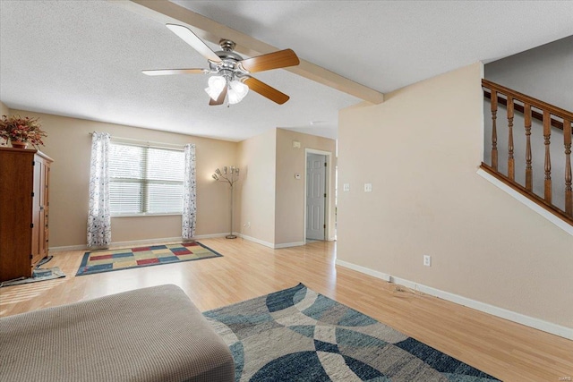 2537 Castle Pines Dr, Imperial, MO 63052 - bedroom featuring wood finished floors, a ceiling fan, baseboards, and a textured ceiling