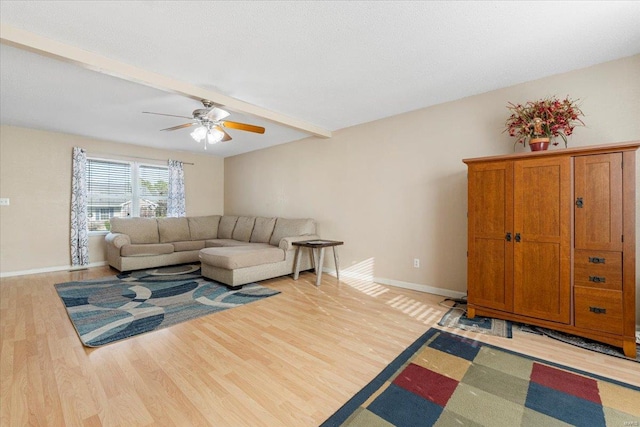 2537 Castle Pines Dr, Imperial, MO 63052 - living room with light wood-style floors, a ceiling fan, beamed ceiling, and baseboards