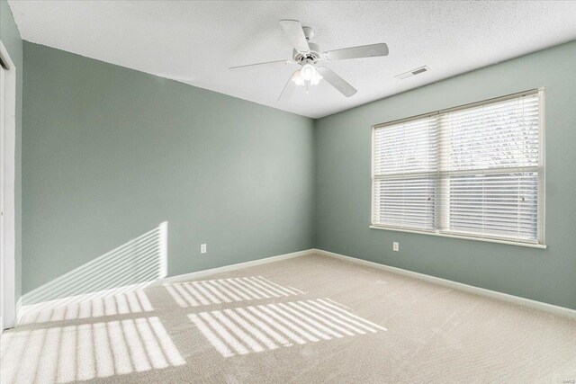 2537 Castle Pines Dr, Imperial, MO 63052 - unfurnished room featuring carpet flooring, a ceiling fan, and baseboards