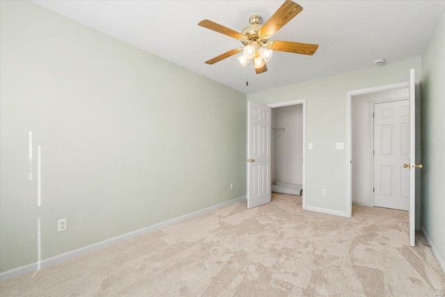 2537 Castle Pines Dr, Imperial, MO 63052 - unfurnished bedroom featuring light carpet, baseboards, and ceiling fan