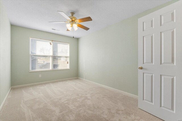2537 Castle Pines Dr, Imperial, MO 63052 - carpeted empty room with ceiling fan, a textured ceiling, and baseboards