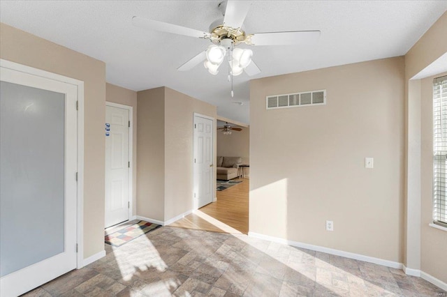 2537 Castle Pines Dr, Imperial, MO 63052 - spare room featuring a ceiling fan and baseboards