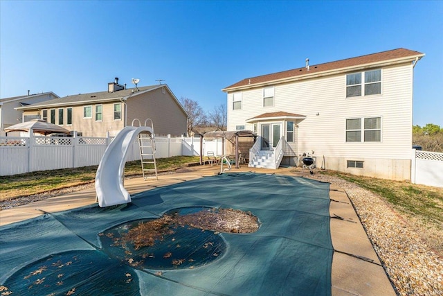 2537 Castle Pines Dr, Imperial, MO 63052 - back of property featuring a fenced backyard and a patio area