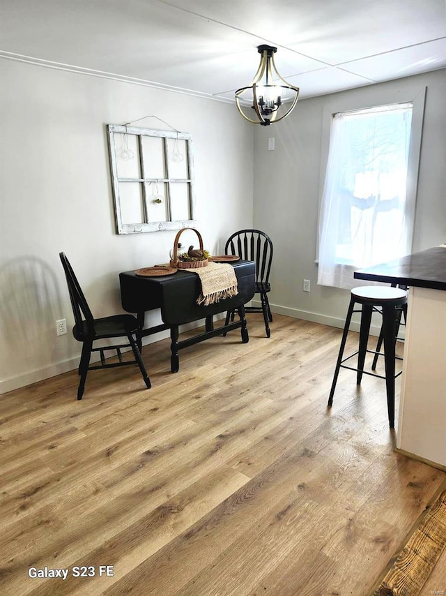 972 Sunny Ridge Vw, Union, MO 63084 - dining area with light wood-style floors, a chandelier, and baseboards