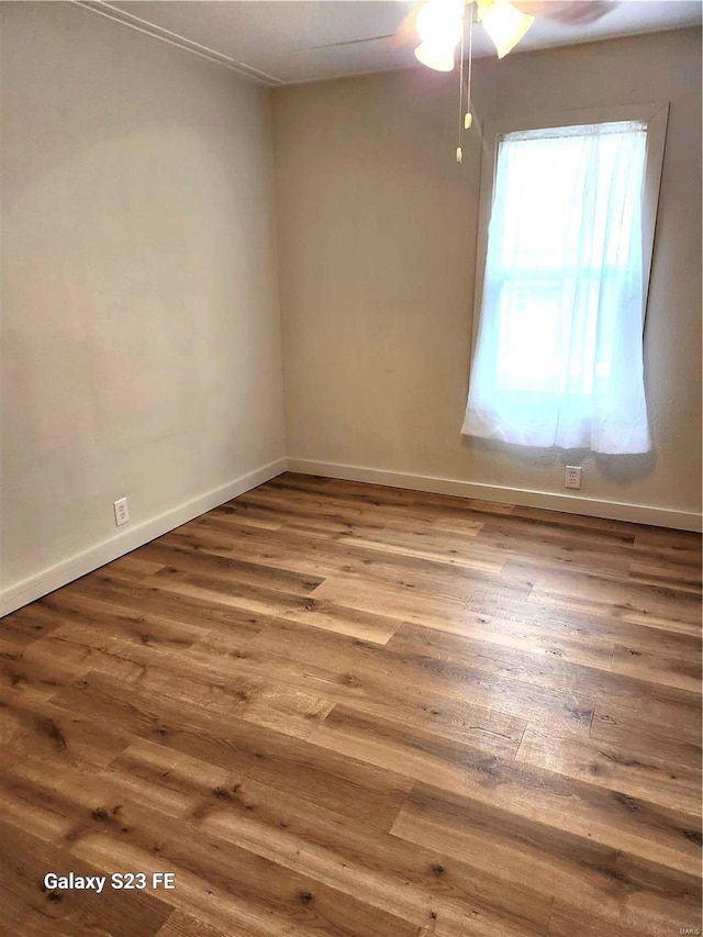 972 Sunny Ridge Vw, Union, MO 63084 - unfurnished room with wood finished floors, a ceiling fan, and baseboards