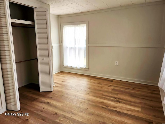 972 Sunny Ridge Vw, Union, MO 63084 - unfurnished bedroom featuring a closet, wood finished floors, and wainscoting