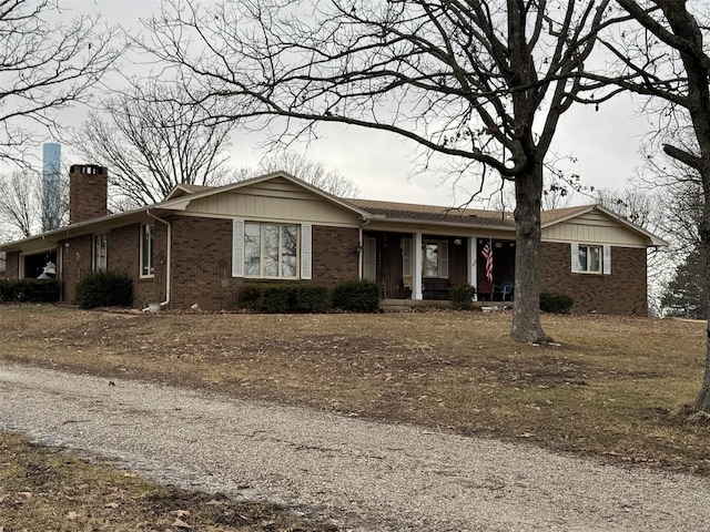 22755 Pin Oak Dr, Lebanon, MO 65536 - ranch-style house featuring a chimney, a porch, and brick siding