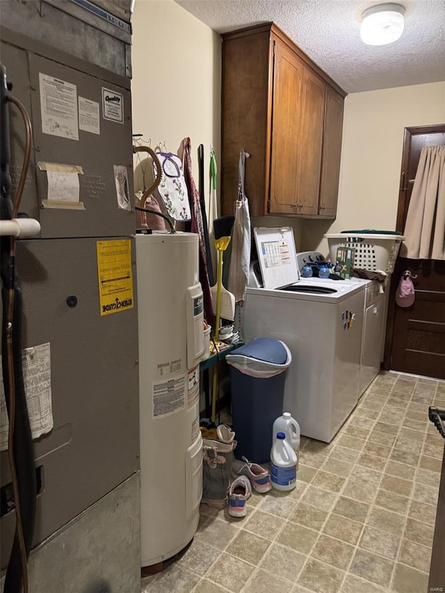 22755 Pin Oak Dr, Lebanon, MO 65536 - laundry area with electric water heater, cabinet space, washing machine and clothes dryer, a textured ceiling, and heating unit