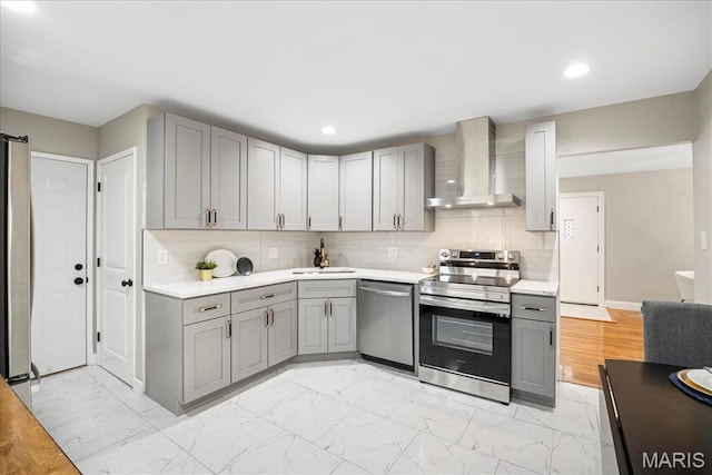 4501 Conleth Dr, Saint Louis, MO 63129 - kitchen featuring wall chimney exhaust hood, gray cabinetry, stainless steel appliances, a sink, and recessed lighting