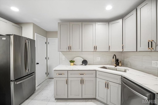 4501 Conleth Dr, Saint Louis, MO 63129 - kitchen featuring stainless steel appliances, a sink, light marble finish flooring, light stone countertops, and gray cabinetry