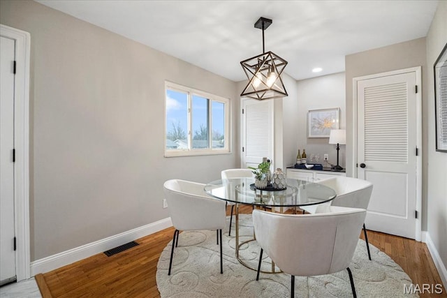 4501 Conleth Dr, Saint Louis, MO 63129 - dining space with baseboards, wood finished floors, and recessed lighting